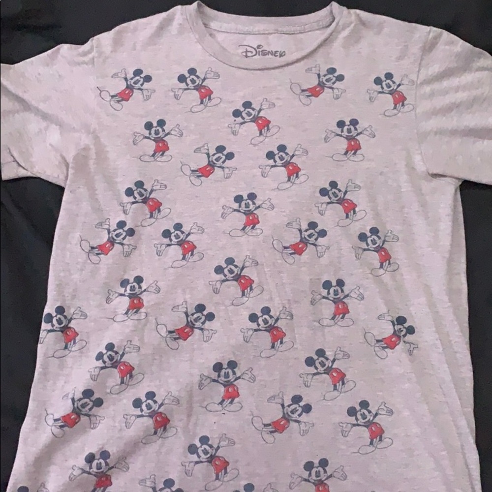 A grey top with Mikey mouse designs